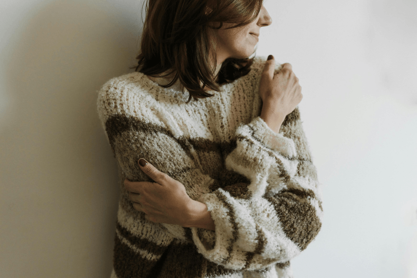 woman giving herself a hug